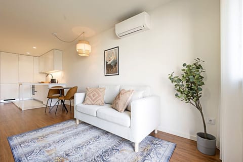 Gorgeous main area, with a comfortable couch, dining area and a lovely kitchenette #modern #stunning