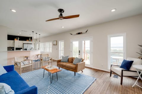 Downstairs living room off kitchen w bar and lake views