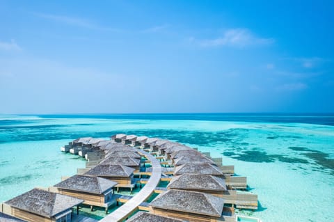 Dheru Water Pool Villa | Minibar, in-room safe, desk, iron/ironing board