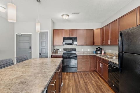 Open, functional kitchen with generous counter space, modern appliances, and a large island that works just as well for quick meals as it does for spreading out and getting things done. Clean lines, solid storage, and easy flow into the living area make it