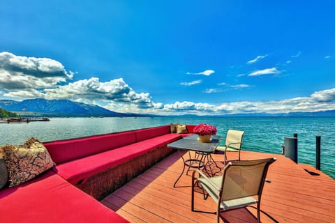 Lake Tahoe Lakefront Level grounds with lawn and stately Sierra trees lead to 100' of breathtaking shoreline with a private pier and two Boat buoys. Lake Tahoe Legacy Sunsets sitting on the Lake
