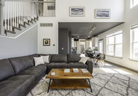 Living Room with gas fireplace, cathedral ceiling, & view of Green Mountain.