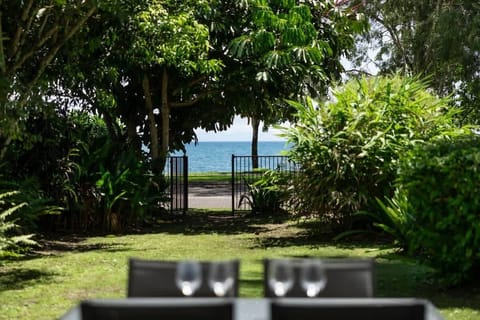 Follow the lush tropical garden toward the beachfront, where glimpses of the Coral Sea invite slow mornings and easy afternoons by the water.