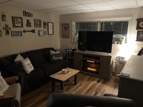 Living Room- Homey, Cozy, and Decorated with my family photos.