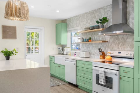 Whip up fresh meals and enjoy family time in this open kitchen and dining area.