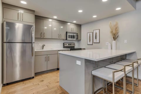 Updated kitchen with stainless appliances and seating for 4 at the counter