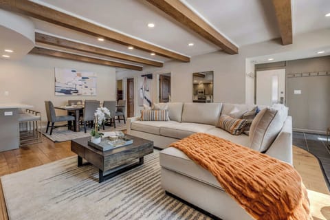 Spacious living room with large comfortable sofa, gas fireplace and Smart TV with streaming services and Xfinity cable