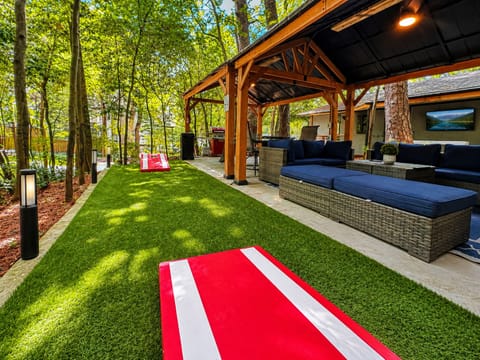Two Private Patio Areas are packed with fun and comfort:
• Covered Lounge w/ BBQ + 55" Outdoor Smart TV
• Private Hot Tub w/ 55" Smart TV
• Outdoor Dining + Double Gazebo
• Games: NEW Ping Pong (Regulation Size), Cornhole, and Giant Jenga