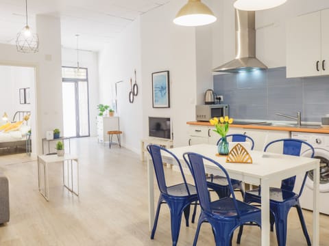 General view of the accommodation, bedroom, kitchenette, and living room with double sofa bed.