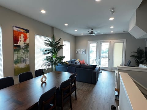 Dining Table and Living Room.  Living room opens onto balcony.
