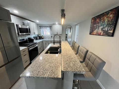 Large eat-in-kitchen with kitchen counter bar top seating