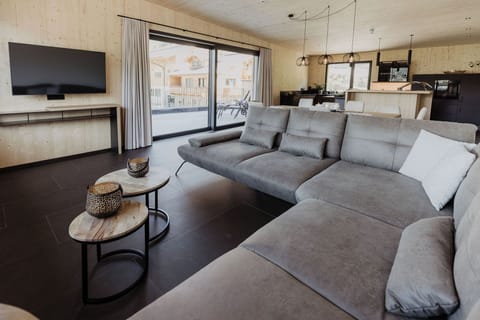 Luxury Penthouse, 4 Bedrooms, Hot Tub, Executive Level (Sauna) | Living room | 50-inch Smart TV with cable channels, TV, heated floors