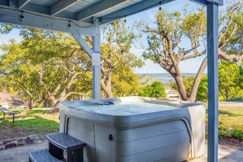 Hot tub area with small views of the lake + table/chairs for entertainment