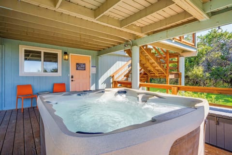 Enjoy a beautiful covered hot tub surrounded by privacy and trees!