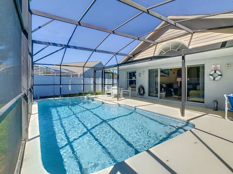 Screened private pool with plenty of sunlight and lounge space.