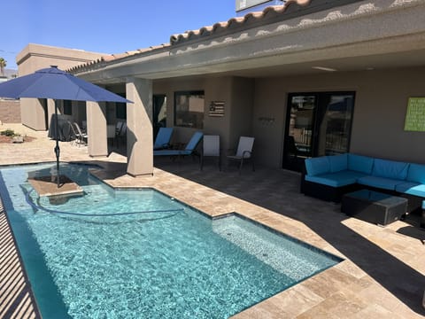 Umbrella and seating area in pool