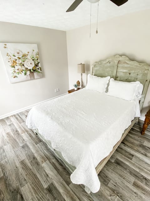 First bedroom with queen size bed and smart TV