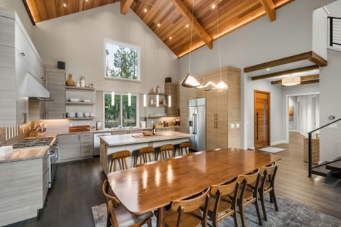 The large dining room table and chef's kitchen make gathering together a joy.