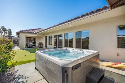 Bubbling hot tub overlooking golf greens.