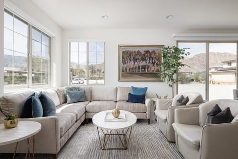 Neutral tones and navy accents create calm sophistication.