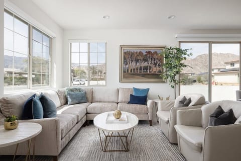 Neutral tones and navy accents create calm sophistication.