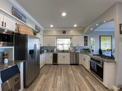 Kitchen with new appliance and commercial grade ice machine.