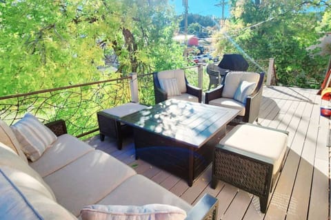 Cozy seating, Firetable, & BBQ Make For Memorable Nights On The Back Deck