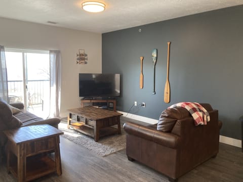 Living room with couch, love seat (hide a bed) and tv 