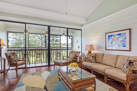 Sunlit living room opening to a breezy lanai for easy indoor-outdoor lounging.