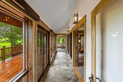 Hallway leading to the Master wing with fitness room.