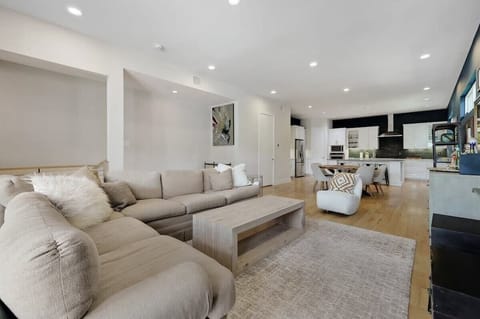 The plush oversized L-shaped couch offers the perfect place to unwind and relax with your loved ones as you catch up and enjoy your favorite movies on the HDTV.