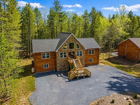 Twilight Exterior View of Cabin with Forest Privacy

