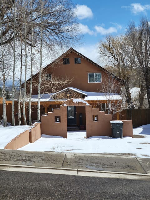 Front of house and parking area.