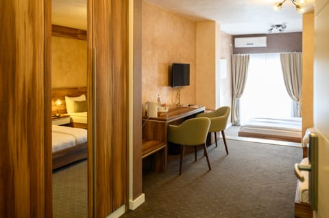 Basic Quadruple Room | Minibar, in-room safe, desk, free WiFi