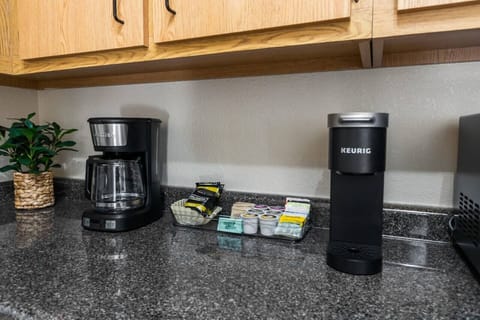 Coffee bar includes all the essentials for your morning brew including a 12 cup coffee maker and a Keurig. A starter pack of ground coffee, K-cups, tea, creamer, sugar and stevia are provided. Enjoy!