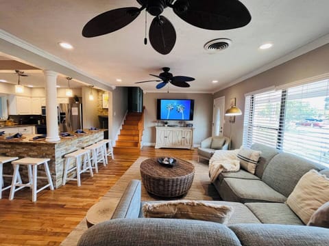 This photo captures the openness of the living area and kitchen and dining space. 
