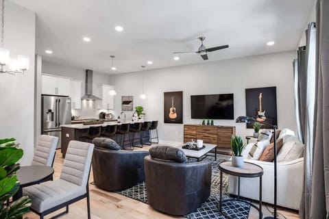 Modern open-concept space blending the kitchen and lounge.