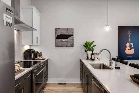 Enjoy a large kitchen with warm brown cabinets and white surfaces.