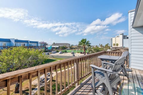 Relax on your private balcony with morning coffee, watching the coastal community come alive below.