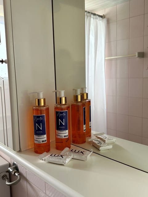 Designer toiletries, hair dryer, towels, soap