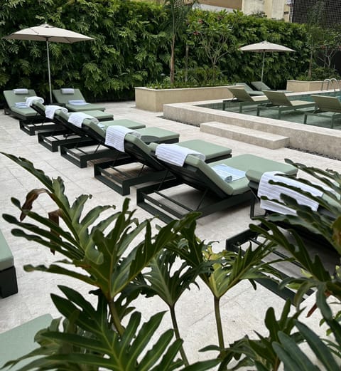 Outdoor pool, open 10:00 AM to 8:00 PM, pool umbrellas, sun loungers