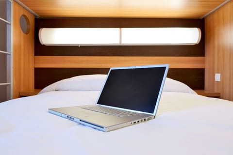Premium bedding, desk, blackout drapes, soundproofing