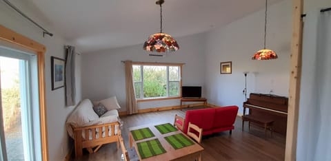 Living room with TV & piano