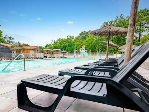 Relaxing poolside loungers, inviting guests to unwind in the sun.