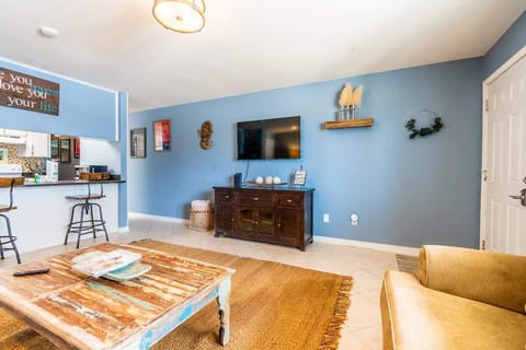 Living room with a pull-out couch and a smart TV for your entertainment.