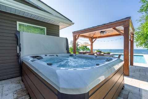 Unwind in the hot tub and watch the sunset over Lake Erie.