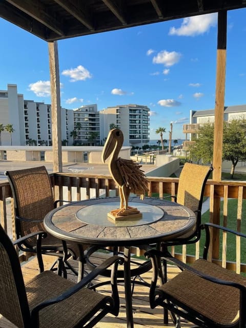 Step onto your private balcony and savor morning coffee while enjoying stunning city views beneath the bright blue sky.