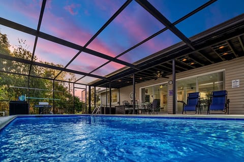 Private screened in heated pool with smart speakers and smart lighting.