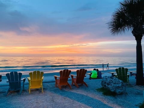 On the beach, white sand, sun loungers, beach umbrellas