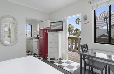 Standard Studio, 1 Queen Bed, Pool View | Living area | 32-inch flat-screen TV with digital channels, TV